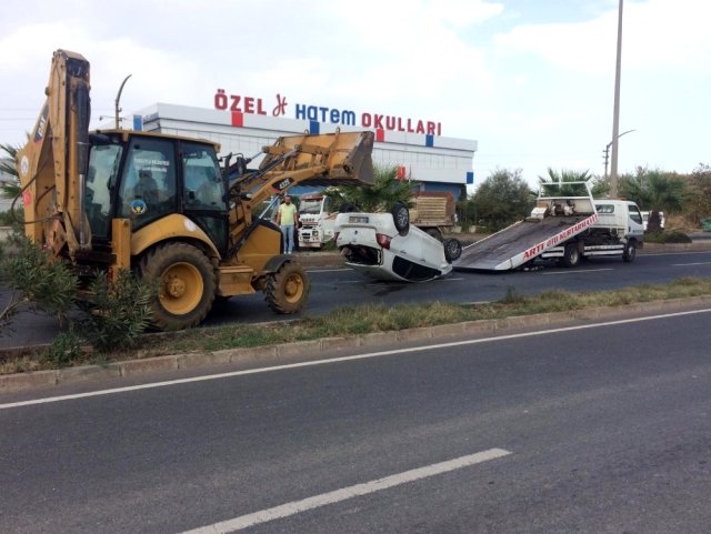 Takla atan otomobilden yara almadan kurtuldular