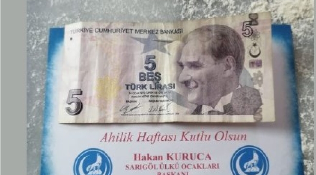 Sarıgöl'de ülkü ocakları esnafa para dağıttı
