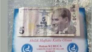 Sarıgöl'de ülkü ocakları esnafa para dağıttı