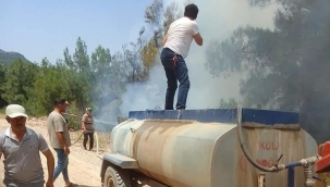 Büyükbelen'de çıkan orman yangını belediye ekipleri söndürdü