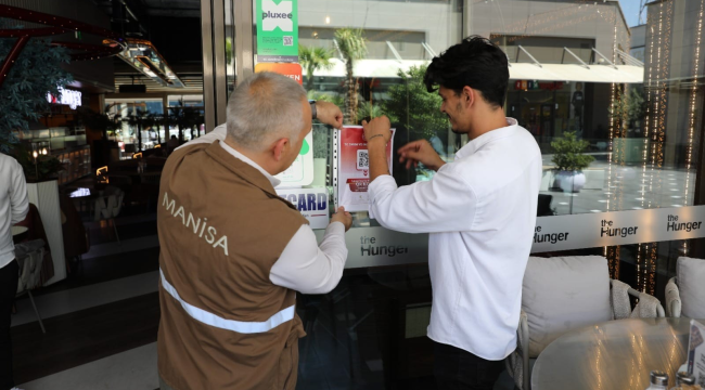 İşletmelerin görünür noktalarına karekod görselleri asıldı